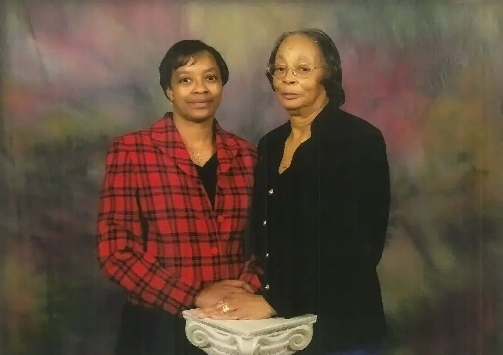 Two women posing for a portrait